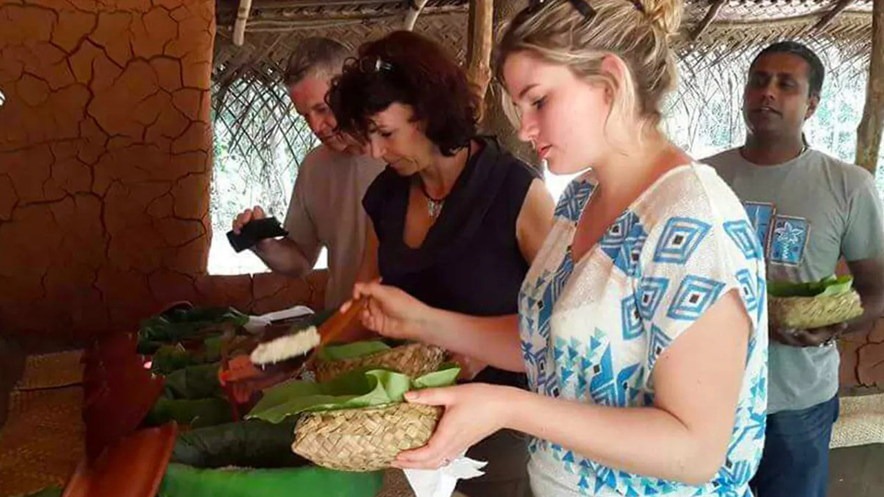 Group of people preparing food in a rustic setting