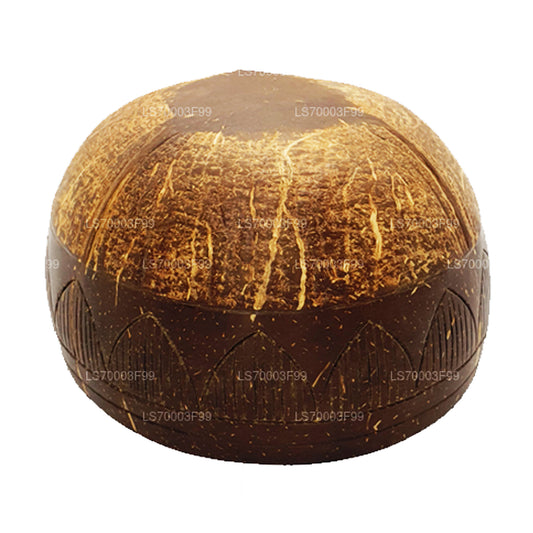 Smoothiekom met kokosnootschaal met lepel en vork